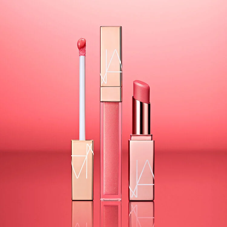 NARS_SP22_SpringEdit_Afterglow_PDPCrop_Stylized_Afterglowlipshine_LipBalm_Orgasm_GLBL_2000x2000
